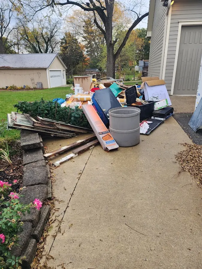 Dumpster being loaded with debris for 30 Yard Dumpster Rental in Montville